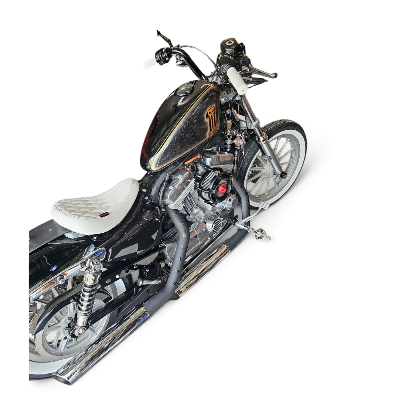 White diamond-stitched solo seat installed on a black Harley-Davidson Sportster motorcycle